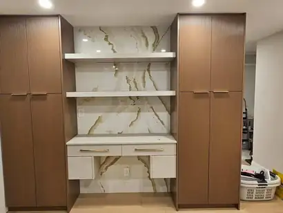 Two wood-grain pantry towers framing floating shelves on a marble-look wall